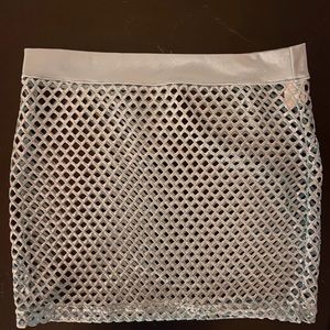 Selling fishnet skirt from iheartraves